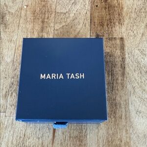 Maria Tash Diamonds in white gold arrow earrings.